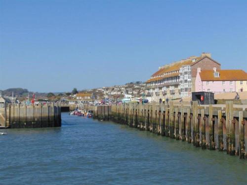 a view of a river with buildings and a city at Seacliff in West Bay