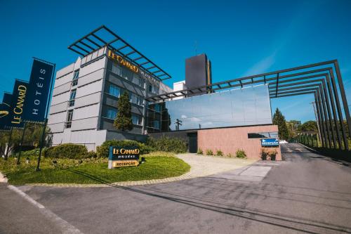 a building with a sign in front of it at Le CanarD Joinville in Joinville