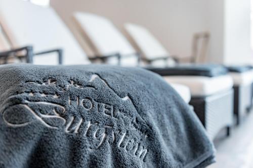 a close up of a towel on a bed at Hotel Burgstein - alpin & lifestyle in Längenfeld