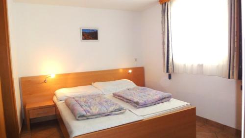 מיטה או מיטות בחדר ב-Gindlhütte