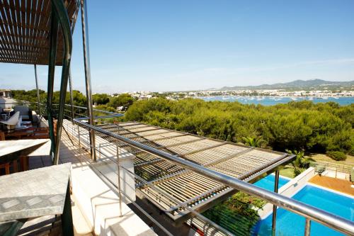 a view from the balcony of a house with a swimming pool at S'Arenal Petit in Portocolom