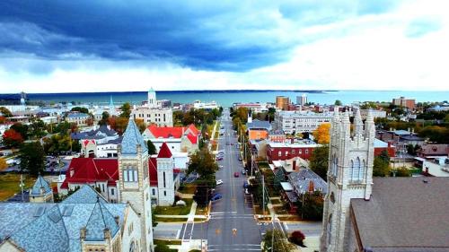 an aerial view of a city with a street and buildings at Wolf Inn Hotel in Sandusky