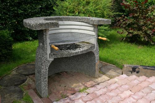 a stone bench with hot dogs sitting on it at Rähni Maja in Põlva