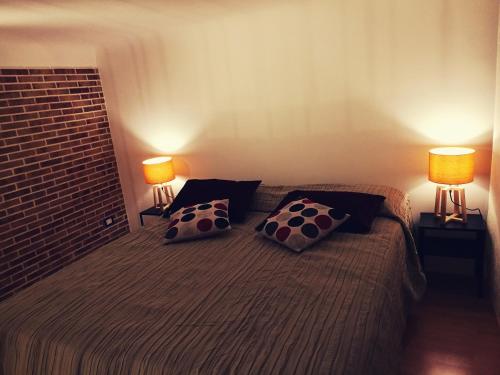 מיטה או מיטות בחדר ב-Ponentino