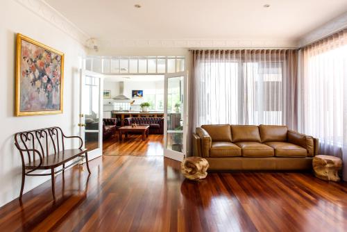 a living room with a couch and a table at Fairlawn Estate in Busselton