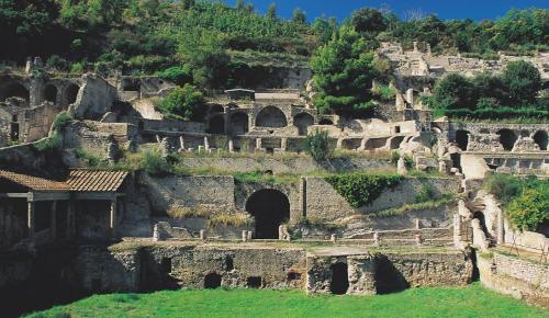 an old building with a tunnel in the side of a mountain at Domus Fortunae B&B in Bacoli