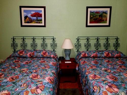 En eller flere senge i et værelse på Parador Guánica 1929