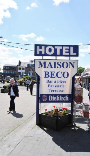 a sign for a hotel masonhewshews restaurant on a street at Hotel Beco in Banneux