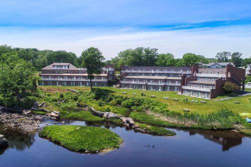 a large body of water with houses and trees at Ogunquit River Inn & Suites, Ascend Hotel Collection in Ogunquit