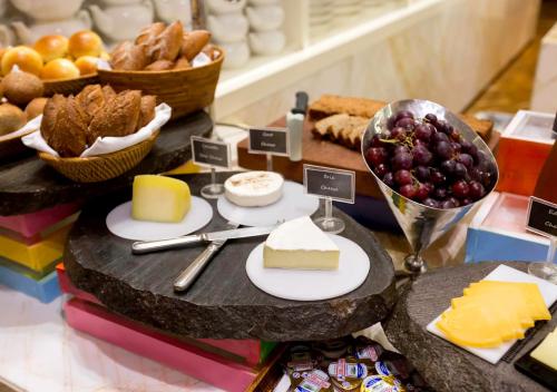 a display of cheese and other foods on a table at Mulia Resort in Nusa Dua