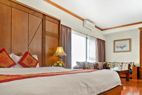 Tempat tidur dalam kamar di Phuong Anh 2 Hotel