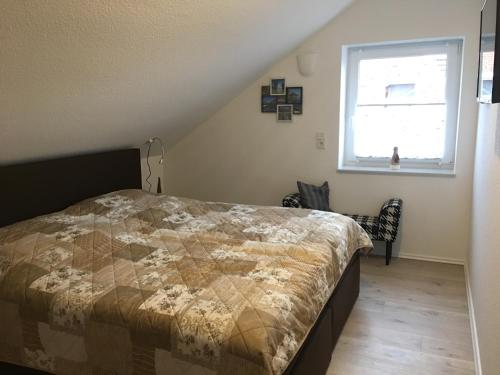 Postel nebo postele na pokoji v ubytování Ferienwohnung Krabbenkutter-Greetsiel