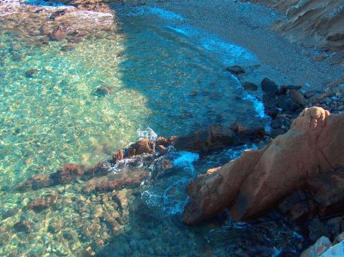 an aerial view of the water near a rocky shore at Vrachokipos in Souvala