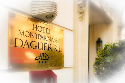 a sign on the side of a hotelmontranceazaazaazaazaemeteryemetery at Montparnasse Daguerre in Paris