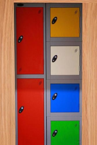 a cabinet with four different colored doors at The Liverpool Pod Travel Hostel in Liverpool