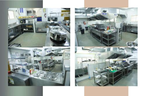 four different views of a kitchen in a laboratory at Hotel Anjali Park in Kottayam