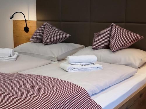 Postel nebo postele na pokoji v ubytování Hotel Aschauer Hof z'Fritzn