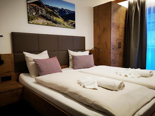 Posteľ alebo postele v izbe v ubytovaní Hotel Aschauer Hof z'Fritzn
