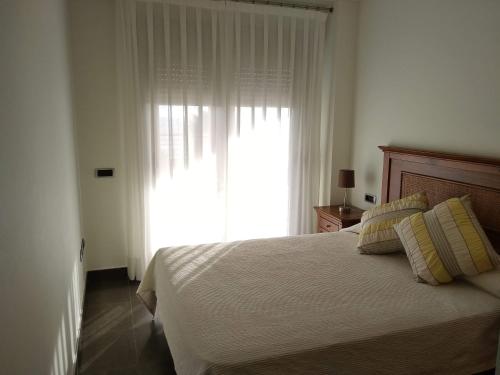 Postel nebo postele na pokoji v ubytování Apartamentos Deluxe Playa Norte