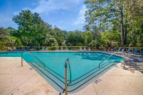a swimming pool with a slide in the middle at Inlet Cove 12 in Kiawah Island