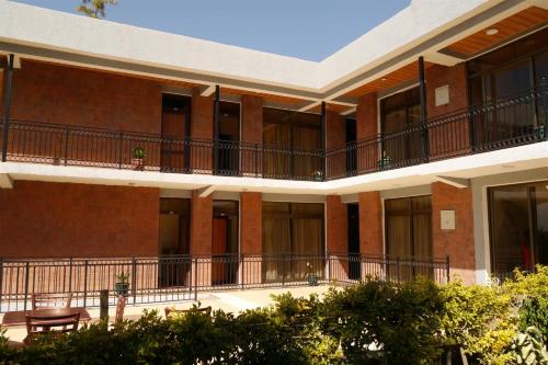an exterior view of a building with balconies at Tabor Hotel Lalibela in Lalībela