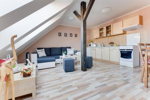 a kitchen and living room in a loft at Jane's Attic Apartment in Prague