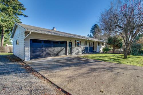 a white house with a blue garage at Dundee Wine Country View in Dundee