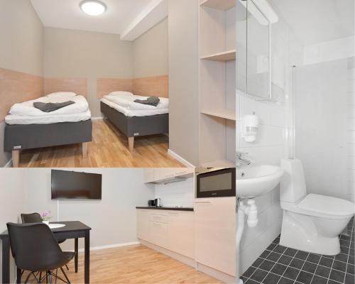 a bathroom with a bed and a toilet and a sink at Chefens Hotell in Södertälje