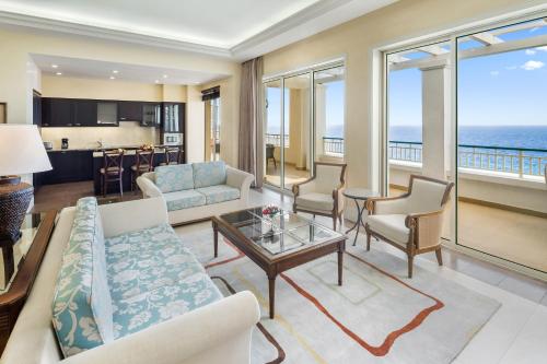 a living room with a couch and a table at Jewel Grande Montego Bay Resort and Spa in Montego Bay