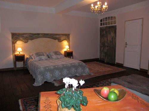 Säng eller sängar i ett rum på Chambres d'Hôtes Aroha
