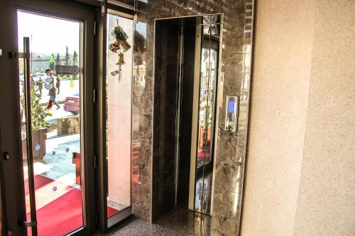 a glass door of a building with a view of a street at Kristal Hotel in Baku