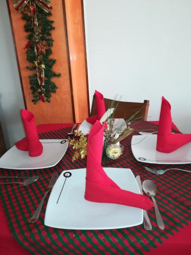 a table with red boots on top of a table at HOTEL COSTA DEL SOL FUSAGASUGa in Fusagasuga