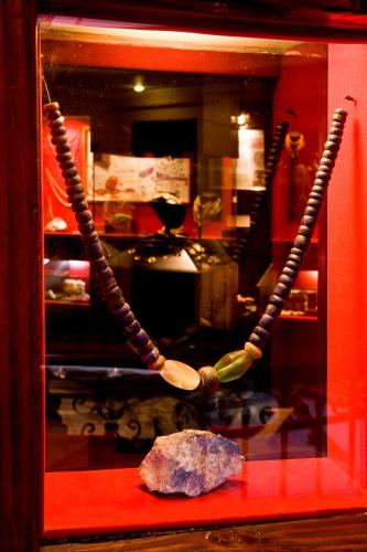 a museum exhibit with a wooden spoon and a rock at Hotel Santa Cruz Plaza in Santa Cruz