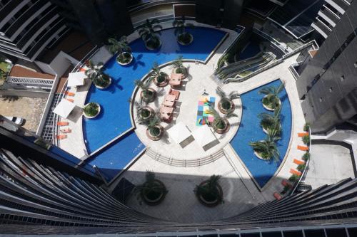 an overhead view of a pool with a resort at Landscape Residence by Escala Imóveis in Fortaleza