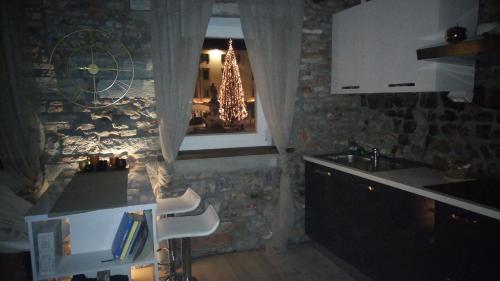 a kitchen with a counter and a sink and a window at L'angolo di Filippo I piano in Cividale del Friuli
