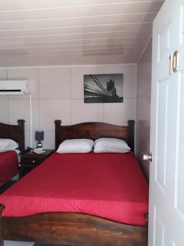 Cama o camas de una habitación en Hostal Compostela Inn
