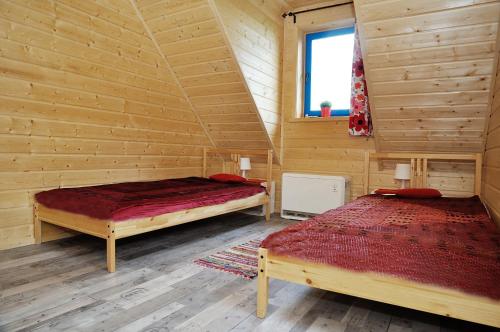 Tempat tidur dalam kamar di Dom Nad Morzem Witome