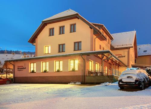 a house with a car parked in front of it at Penzion Krumlov - Massage studio in Český Krumlov