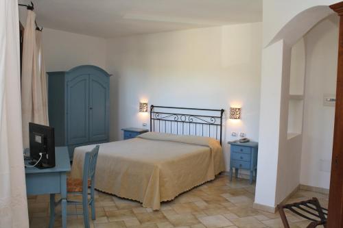 A bed or beds in a room at Hotel San Pantaleo