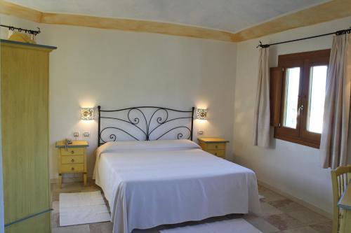 Ένα ή περισσότερα κρεβάτια σε δωμάτιο στο Hotel San Pantaleo