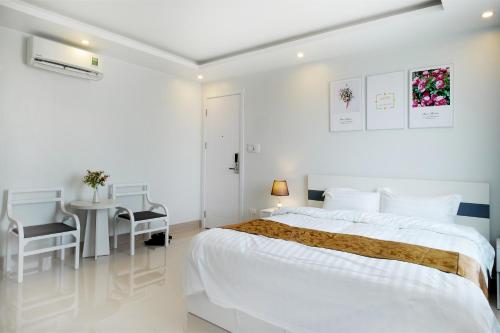 Кровать или кровати в номере Thiên An Hotel