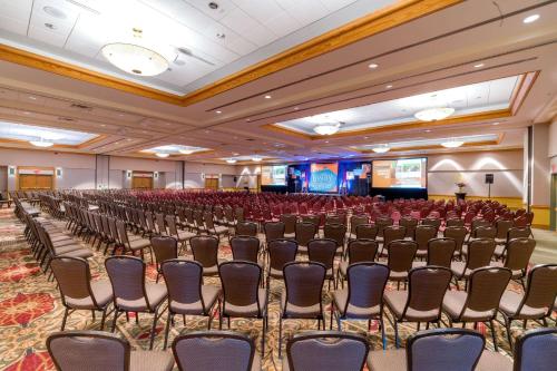 a conference room with rows of chairs and a stage at Holiday Inn Estes Park by IHG in Estes Park