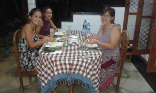 a group of women sitting at a table at Sigiri Anu Homestay in Sigiriya