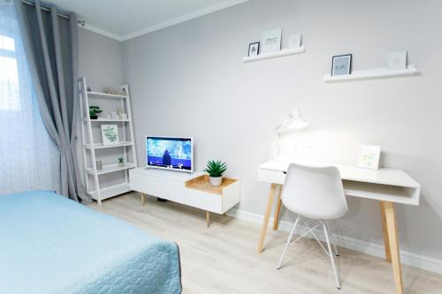 TV a/nebo společenská místnost v ubytování Apart-Hotel "LAVINA"