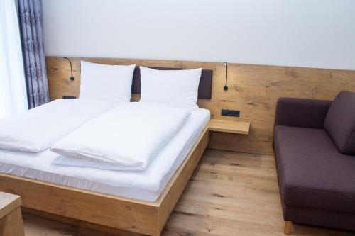Ein Bett oder Betten in einem Zimmer der Unterkunft Panorama Apart Weisses Rössl