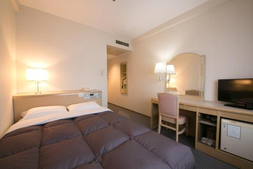 Tempat tidur dalam kamar di Tottori Washington Hotel Plaza