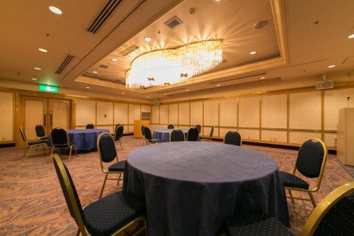 a conference room with tables and chairs in it at Tottori Washington Hotel Plaza in Tottori
