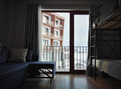 En eller flere senge i et værelse på Alpéstrine - Vista Gudauri - Apartment N27