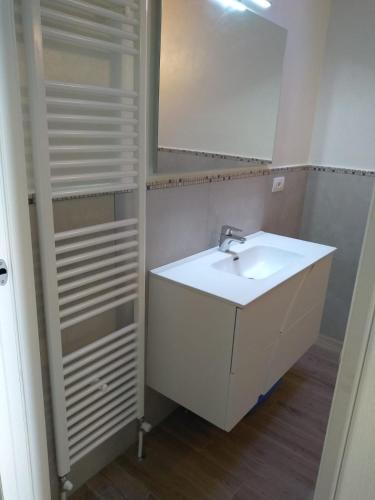 a bathroom with a white sink and a mirror at "Country House il Brolo" in Polpenazze del Garda
