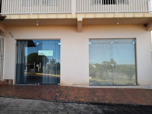an entrance to a building with a large glass door at Suíte na Canastra in São Roque de Minas